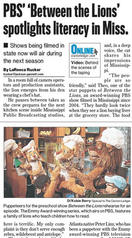 A picture of a newspaper article about the PBS show Between the Lions.